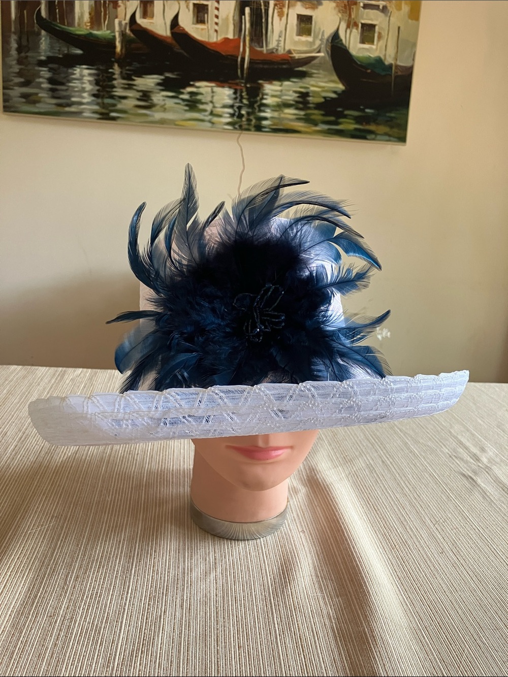 Chic White Wide-Brim Hat with Navy Feather Bloom